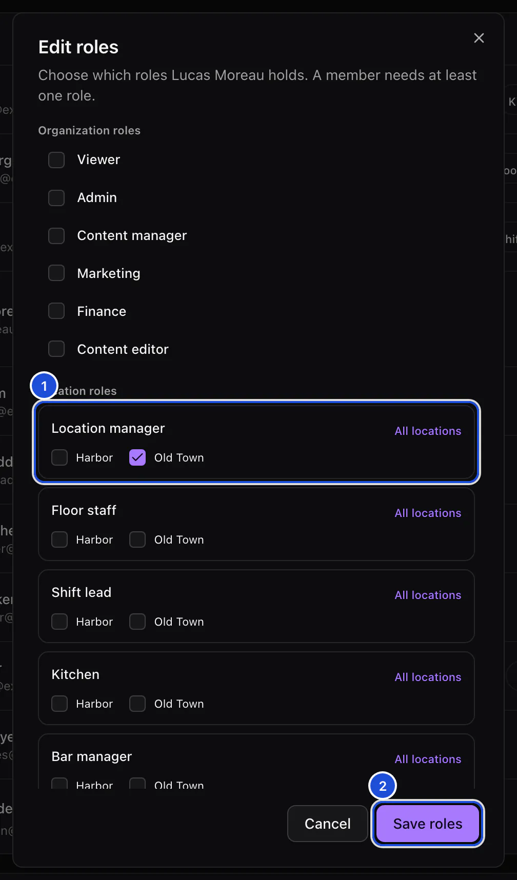 The Edit roles dialog for a location manager: the organization roles unticked, Location manager ticked at Old Town, and the Save roles button.