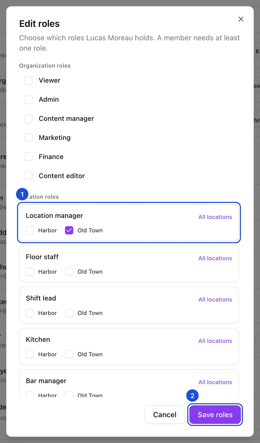 The Edit roles dialog for a location manager: the organization roles unticked, Location manager ticked at Old Town, and the Save roles button.