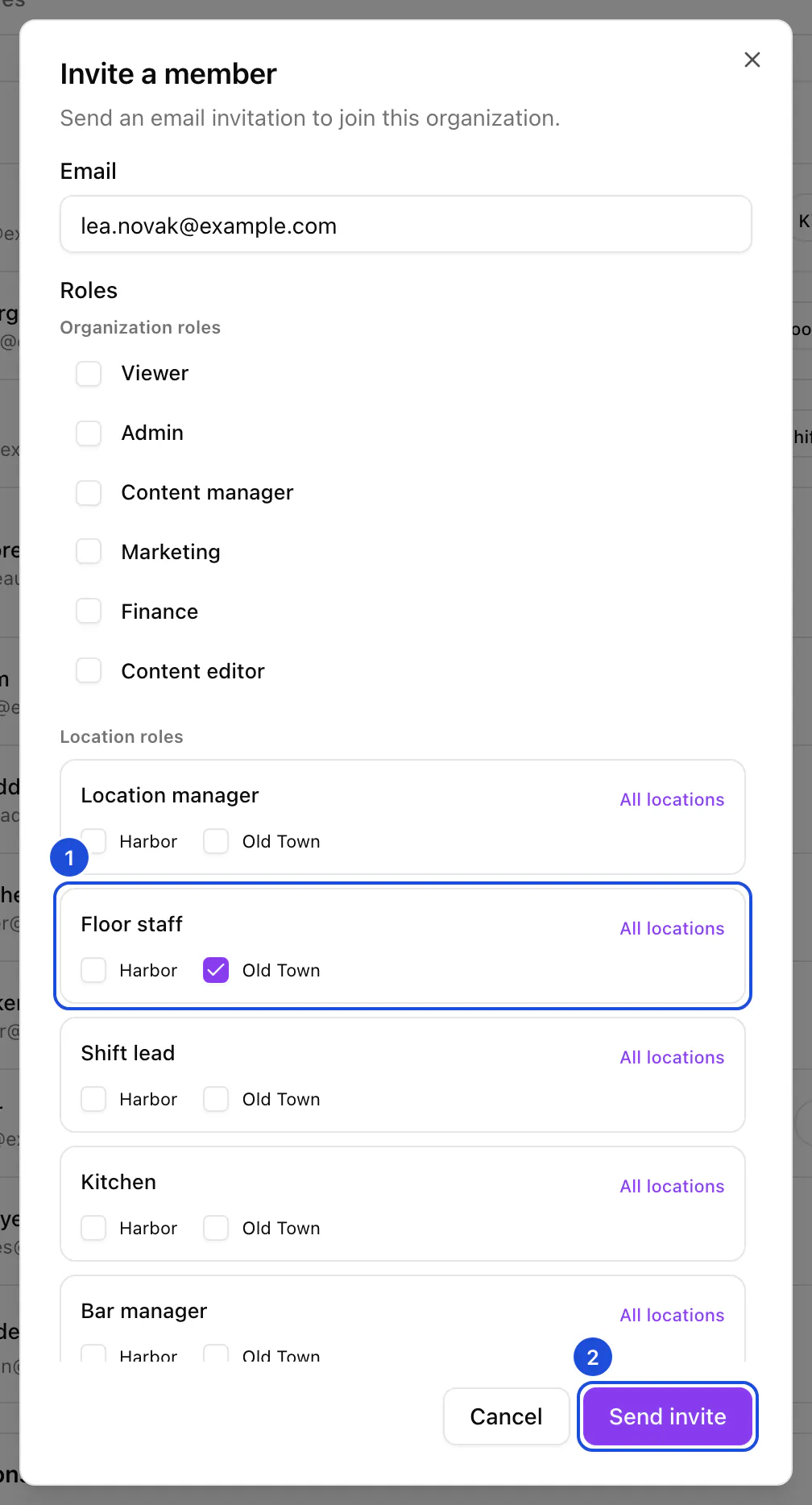 The Invite a member dialog: an email address entered, the organization roles unticked and Floor staff ticked at Old Town.